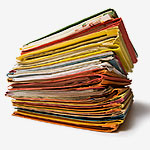 Documents piled up that Pearl Scan can scan to help businesses save time and money in London and accross the UK.